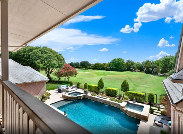 Pool and golf-course view from a Creeks of Willow Bend home in Plano, Texas