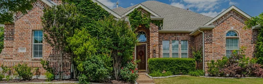 Single-story brick home with mature landscaping in Daniel Crossing, Murphy, Texas