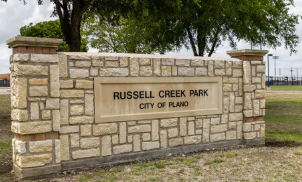 Russell Creek Park monument sign near Highland Ridge in Plano, Texas