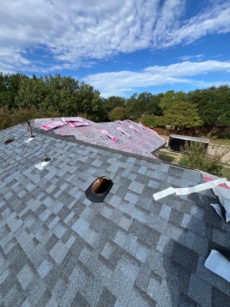 Close-up of architectural shingles being installed on an Allen, Texas roof