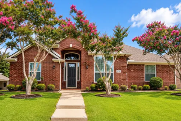 Red brick ranch home with crepe myrtles in Travis Estates, Murphy, Texas