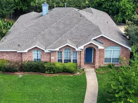 Multi-tone brick ranch with blue door in Windy Hills Farms, Murphy, Texas